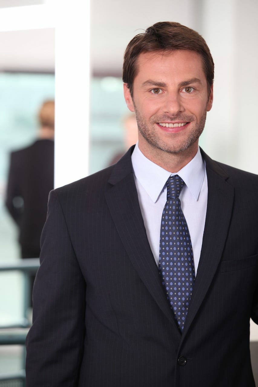 5606884_closeup-of-a-smiling-man-in-agency